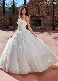 a woman in a wedding dress posing for the camera