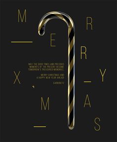 a candy cane with the words merry christmas written in gold and black on a black background