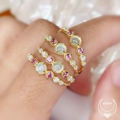 Crafted to give you that positive celestial vibe - the ring has the Opal daintily sited and beaming like a full moon, while gravitating towards the Pink Tourmaline and White Topaz to give you a supernatural sparkle. Shop now! White Opal Celestial Ring, Celestial White Opal Ring, Celestial Style White Opal Ring, Pink Opal Jewelry With Gemstone Detail, Pink Opal Jewelry With Gemstone, Adjustable Pink Opal Ring, Celestial Style Opal Round Rings, Adjustable Pink Round Opal Ring, Pink Opal Ring With Accent Stones As Gift