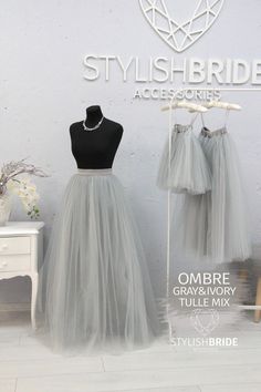 two grey tulle skirts on display in front of a sign that says stylish bride accessories