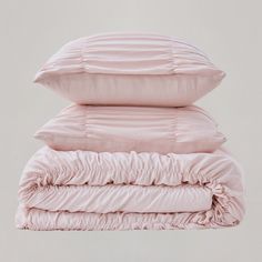 three pillows stacked on top of each other