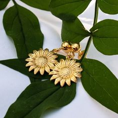 ✨Sunflower Charm Earrings - Stud, Sterling Silver or Gold✨ ⭐️  DIMENSIONS:  Charms measure: 16x18.5mm Stud with loop 12mm ⭐️ MATERIALS:  925 Sterling Silver  or  24K Gold over 925 Sterling Silver ⭐️ Handmade By us in UK N.B. For hygiene reasons, we regret we are unable to accept returns for earrings unless faulty. ⭐️ PACKAGING:  Each item arrives beautifully presented in our signature ISOBEL JACKSON jewellery gift box. Our boxes not only protect your item, they add the perfect finishing touch fo Gold Sunflower Dangle Jewelry, Gold Sunflower Adjustable Flower Earrings, Adjustable Gold Sunflower Earrings, Sunflower Charm, Sunflower Earrings, Earrings In Gold, Jewellery Gift, Flower Charm, Sterling Silver Studs