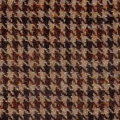 a close up view of a brown and white checkered fabric