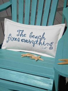 a pillow that says the beach fixes everything on it sitting on a blue chair