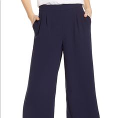 In And Of-The-Moment Cropped And Wide-Leg Silhouette, These Seasonless Crepe Pants Are Ideal For Travel Or Wearing Repeatedly. Chic Navy Bottoms For Formal Occasion, Chic Navy Formal Bottoms, Navy Wide-leg Workwear Bottoms, Chic Navy Wide Leg Workwear Pants, Navy Wide-leg Workwear Pants, Chic Navy Wide Leg Pants For Work, Casual Business Wide-leg Pantsuit, Navy Wide-leg Pants For Work, Navy Pants For Business Casual In Spring