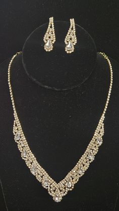 Necklace Size : 16" + 3" L Decor Size : 0.75" L Earring Size : 1.5" L Rhinestone Pave Crystal Teardrop Detail V Necklace Gold Prom Necklace, 2 Piece Dress Short, Prom Gold, Prom Necklace, V Necklace, Designer Formal Dresses, Prom Necklaces, Short Cocktail Dress, Necklace Size