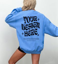 Blue Graphic Print Hoodie With Crew Neck, Light Blue Crew Neck Sweatshirt With Ribbed Cuffs, Blue Relaxed Fit Sweatshirt, Light Blue Relaxed Fit Crew Neck Sweater, Blue Drop Shoulder Sweater With Ribbed Cuffs, Blue Graphic Print Crew Top, Light Blue Crew Neck Sweatshirt With Letter Print, Blue Crew Neck Top With Graphic Print, Sporty Blue Drop Shoulder Tops