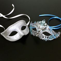 The simple masquerade mask for men comes in silver , and the mask for women in silver with teal glitter is specially designed to look sheen with embedded rhinestones. Perfect for any event or function. Silver Masks For Costume Party, Silver Mask For Costume Party, Silver Eye Mask For Carnival Masquerade, Silver Eye Mask For Carnival, Silver Eye Mask For Masquerade, Silver Eye Mask For Mardi Gras, Venetian Silver Masks For Carnival, Silver Masquerade Mask For Carnival, Silver Venetian Masquerade Mask For Costume Party