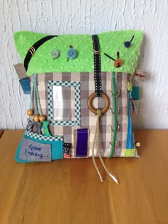 a green purse sitting on top of a wooden table