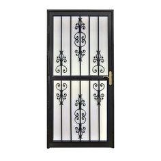 an iron door with glass panels and wrought designs on the sides, against a white background