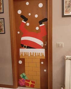 a door decorated to look like santa clause