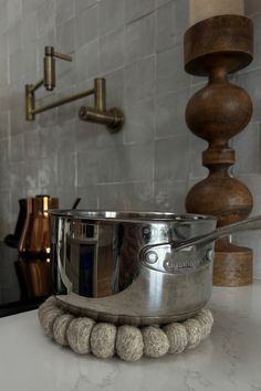 a stainless steel bowl sitting on top of a counter