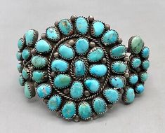 (eBay) APPROX AGE: Circa 1930s. CONDITION: Good for its age, normal wear expected. Classic Handmade Turquoise Bracelets, Antique Blue Round Bracelets, Turquoise Bangle For Formal Occasions, Formal Turquoise Bangle Jewelry, Vintage Turquoise Oyster Bracelet, Vintage Turquoise Bracelets As Gift, Blue Oval Vintage Cuff Bracelet, Antique Turquoise Adjustable Bracelet, Antique Adjustable Turquoise Bracelet