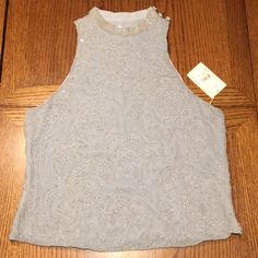 Make Me An Offer Nwt Giorgio Armani Sleeveless Beaded Shirt. Size 10 Bluish Gray In Color With Clear Beads The Tag Has A Certificate Of Authenticity On It. Please Make Me An Offer. All Offers Will Be Considered! Glamorous Embellished Sleeveless Blouse, Glamorous Embellished Sleeveless Top, Elegant Tank Top For Party, Elegant Sleeveless Blouse With Pearl Embroidery, Embellished Sleeveless Top For Evening, Sleeveless Embellished Top For Evening, Elegant Sleeveless Blouse With Sequins, Sleeveless Party Blouse With Pearl Embroidery, Elegant Tank Blouse For Party