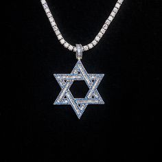 Introducing the Sapphire Baguette Star of David Pendant- a symbol of protection, unity, and connection. Crafted with detail and care, this pendant shines with hand-set sapphire stones, honoring spirituality and the Jewish religion. Wear it daily or for special occasions to add a touch of tradition to your look. Pair it with a Diamond Tennis Chain for a set that will shine! This product is guaranteed for life - GLD will repair the item should you experience any defects in craftsmanship or breakag Luxury Silver Star Of David Jewelry, Luxury Sterling Silver Star Of David Jewelry, Luxury White Gold Star Of David Jewelry, Luxury Blue Star-shaped Jewelry, White Gold Star Of David Spiritual Jewelry, Spiritual White Gold Star Of David Jewelry, Spiritual Star Of David White Gold Jewelry, Celestial Diamond Star Of David Jewelry, Symbol Of Protection