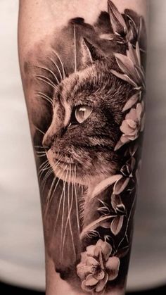 a cat with flowers on it's arm and the image is done in black and white