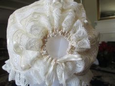 This delicate bonnet is made completely of lace strips sewn together. Ribbons tie at back and under chin. Perfect for any occasion! Measure from bottom of earlobe over the top of head to bottom of earlobe Note: 2 different bonnets are depicted. Laces may vary due to availability Elegant Lace Bonnet With Lace Trim, Adjustable Lace Wedding Bonnet, White Adjustable Lace Bonnet, White Lace Adjustable Bonnet, Fitted Cream Bonnet With Lace Trim, Lace Bonnet, Easter Sunday, Ribbon Tie, Over The Top