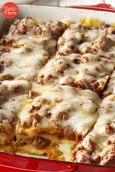 a casserole dish with meat and cheese on top, in a red pan