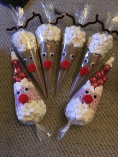 four christmas treats wrapped in cellophane to look like santa's reindeers