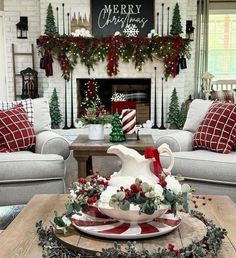 a living room decorated for christmas with red and white decor