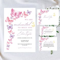 wedding stationery with watercolor butterflies and flowers on it, including the bride's name