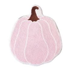 a pink and brown pumpkin shaped rug