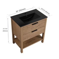 a bathroom vanity with black counter top and wooden legs, measurements for the sink area