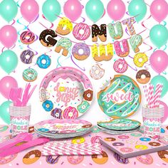 a birthday party with donuts and balloons