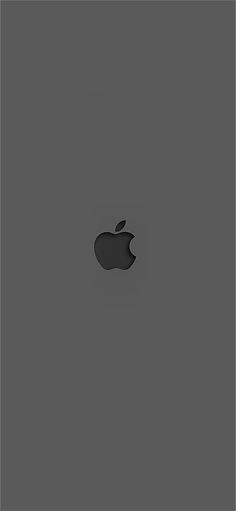 an apple logo is shown on the back of a gray background with space for text