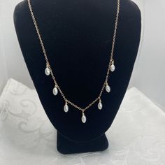 "Class pearl drop necklace with non tarnish gold fill.  I used 7 pearls that are  4.5mm x 8 mm long.  These are rice shaped pearls- added a touch of 2.5 mm gold filled beads on top of each.  I spaced them 3/4\" apart for the best drape. You choose between 16, 17 or 18 inches long in options. This is a beautiful necklace on its own or as a layering piece.  Perfect Spring  gift for you or someone you love! The drop pearl earring is a separate listing." Gold Dangle Charm Necklace With Pearl Drop, Gold Teardrop Pearl Necklace With Adjustable Chain, Gold Dangle Necklaces With Pearl Drop, Gold Drop Necklaces With Pearl Chain, Gold Teardrop Pearl Charm Necklaces, Gold Teardrop Pearl Chain Drop Necklace, Gold Teardrop Pearl Drop Necklace, Gold Teardrop Pearl Necklace, Gold Teardrop Charm Necklace With Pearl