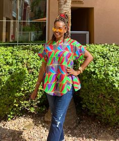 "Unique African print top made from African fabric 100% cotton. This colorful Ankara summer blouse is versatile, flattering, and available for all sizes including plus sizes. Features: Ankara blouse with split neckline. African shirt for women with side slits and fun curved hem. Wear this African top over pants, skirts, shorts, or jeans! This item will be specially handcrafted for you upon purchase. We appreciate including your bust, waist, and hip measurements at checkout otherwise, we will use Casual Multicolor Tunic Blouse, Multicolor Split Neck Casual Top, Multicolor Tunic Top For The Beach, Printed Multicolor Cotton Blouse, Multicolor Tunic Top For Beach, Multicolor Short Sleeve Tunic For Vacation, Casual Multicolor Short Sleeve Tunic, Casual Blouse With Vibrant Print And Short Sleeves, Cotton Tops With Vibrant Print