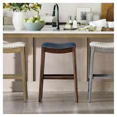 two stools in front of a kitchen counter