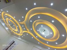 the ceiling is decorated with lights and circles