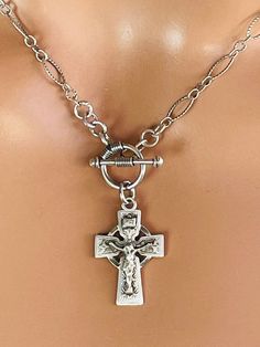 This is a beautiful oxidized 925 sterling silver chain necklace with beautifully detailed ornate crucifix cross that measures 24X16MM. This beautiful pendant hangs on a toggle and textured 7x5mm link chain.  Model is wearing a 16" length, choose your desired length. Comes in a cute gift box! Please pay attention to processing and ship times. Please message me if you have any questions. Thank you Cross Choker, Crucifix Necklace, Cute Gift Boxes, Sterling Silver Chain Necklace, 925 Sterling Silver Chain, Chain Choker, Silver Cross, Silver Chain Necklace, Oxidized Sterling Silver