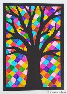 an art project with colorful squares and a tree