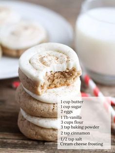 a stack of cookies sitting on top of each other next to a glass of milk