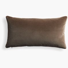 a dark brown pillow on a white background with a black line across the bottom of it