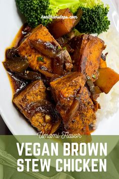 vegan brown stew with broccoli and rice on a white plate in front of a green background