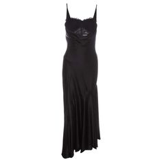 For Sale on 1stDibs - Alexander McQueen black silk bias cut evening dress with built-in corseted bodysuit, low plunge neckline and open back. Spring-Summer 2004 Gown Aesthetic, Open Back Black Dress, Prom Dress Inspo, Alexander Mcqueen Dresses, Cowl Dress, Black Wool Blazer, Velvet Cocktail Dress, Strapless Bustier, Vera Wang