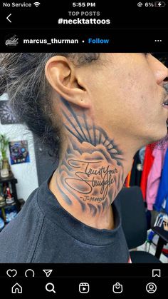 a man with a tattoo on his neck