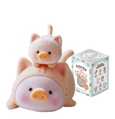 a small stuffed pig sitting on top of a toy box next to it's packaging