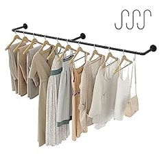 a rack that has some clothes hanging on it