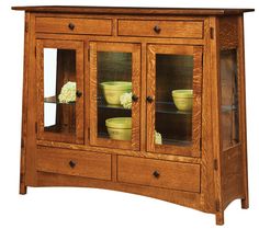 a wooden cabinet with glass doors and drawers