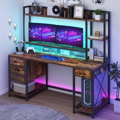 a computer desk with neon lights on it in front of a white wall and wooden floor