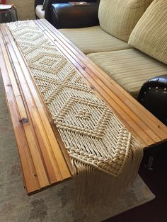 a table made out of wood and rope