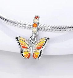 Stunning orange and yellow butterfly charm for Charm bracelet with bright zircon stones Build your own unique charm bracelet with the array of charms available in my store  All our charms are compatible with pandora charm bracelet  As always thanks for viewing 🤍 Orange Charm Bracelet, Yellow Jewelry With Butterfly Charm For Gift, Silver Adjustable Charm Bracelet With Butterfly, Elegant Multicolor Butterfly Charm Jewelry, Pink Butterfly Charm Bracelet Jewelry, Butterfly Gifts, Pandora Bracelet Charms, Yellow Butterfly, Butterfly Charm