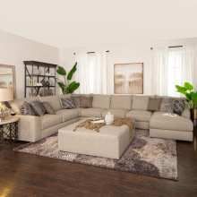 a living room filled with furniture and a large rug on top of a hard wood floor