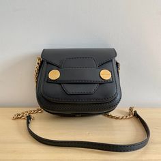 Stella Mccartney “Popper” Crossbody Black Eco-Faux Leather. Chain Strap. Flap Closure. Made In Italy. Beautiful Brown Interior. Interior Pocket. Gold Buttons, One With Logo. Great Condition; Never Worn. 6.5" H X 7.5" W X 4" D Luxury Black Shoulder Saddle Bag, Luxury Black Saddle Shoulder Bag, Luxury Black Saddle Bag With Branded Hardware, Black Luxury Saddle Bag With Detachable Strap, Luxury Black Saddle Bag With Detachable Strap, Luxury Black Saddle Bag With Detachable Handle, Luxury Black Saddle Bag For Evening, Luxury Black Flap Bag With Metal Hardware, Luxury Black Saddle Bag With Metal Hardware