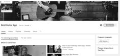 a black and white photo of a man playing an acoustic guitar on the web page