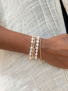 "Beautified with an assemblage of lustrous white freshwater pearl beads, this 18k gold filled pearl bracelet alludes to the soothing sands of Hawaii's shores. Wear this gold pearl bracelet alone or stacked for a classically elegant look. ✦ DETAILS ✦ ✧ Name: Hiwahiwa (HEEvah HEEvah) - precious, beloved, indulged. ✧ Adjustable Length from: 7\"-8.5\". ✧ White Freshwater Pearls. ✧ 14kt Gold Filled Components, Extender, and Clasp. ✧ All Ke Aloha Jewelry pieces come packaged thoughtfully, beautifully, White Single Strand Beaded Bracelet For Gift, White Oyster Bracelet Bangle, Elegant Faceted Beads Bracelets For Beach, White Single Strand Bracelet As A Gift, White Single Strand Bracelet Gift, White Bracelets With Pearl Charm For Beach, White Beaded Bracelets With Jubilee Style, Adjustable White Pearl Bracelets, Pearl White Single Strand Beaded Bracelets